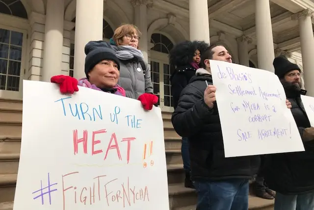 Activists attend a protest on Sunday to protest NYCHA's privatization plan.